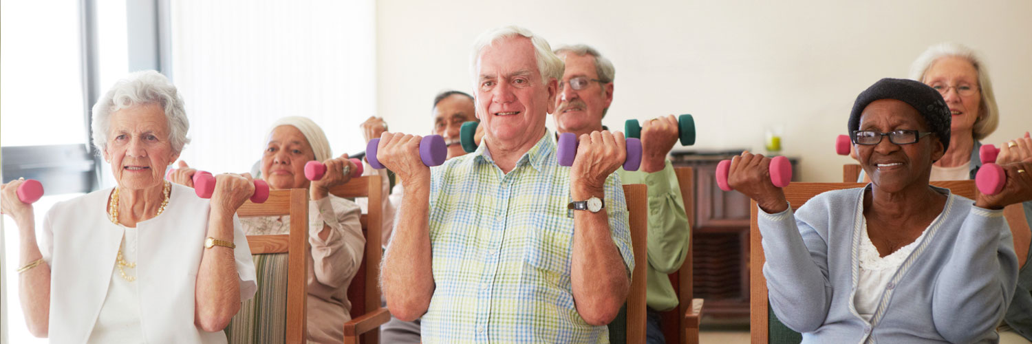 Group of elderly people lifting hand weights
